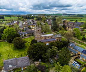 Fototapeta na wymiar An aerial view north east over the church and village of Chipping Warden, UK in summertime