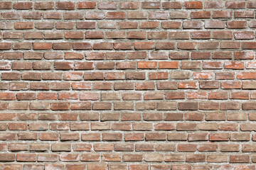 Reddish brick wall. Outside wall.
