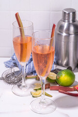 Rhubarb Champagne Fizz cocktail, summer cold alcohol drink in champagne glasses