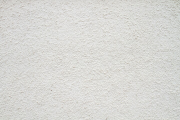 the texture of white plaster or a wall with small indentations.6