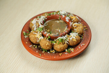Fuchka or pani puri and gol gappay with sour water, served in dish isolated on table top view of indian, bangladeshi and pakistani street food © Food Shop
