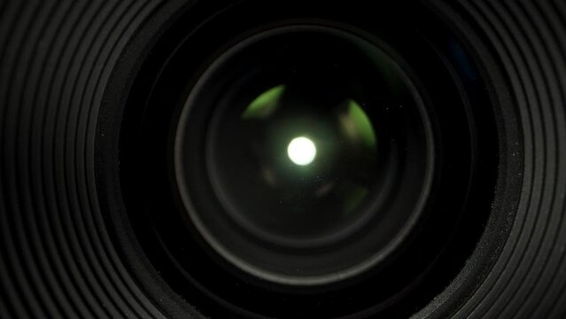 the front lens of the camera lens, and the light inside. Dolly slider extreme close-up.