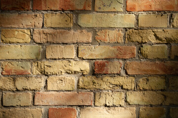 Textured old red brick wall