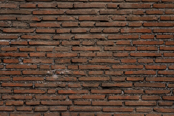 Textured old red brick wall