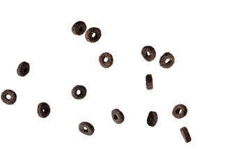 Chocolate rings cereal spill out into a bowl. Breakfast.