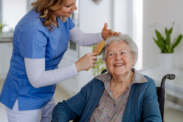 Nurse doing hairstyle to her senior woman client. - obrazy, fototapety, plakaty