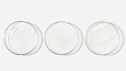 Three Petri dishes on a light background with liquid, water. Splashes of water. Waves in the petri dishes. View from above. Laboratory