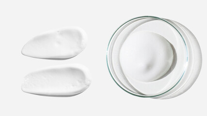 Foam, foam texture. Washing with foam. Foam in a Petri dish on a light background. Dab of cosmetic foam. Lab.
