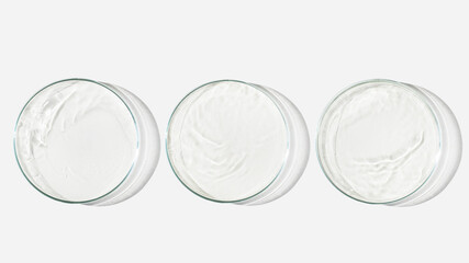 Three Petri dishes on a light background with liquid, water. Splashes of water. Waves in the petri...