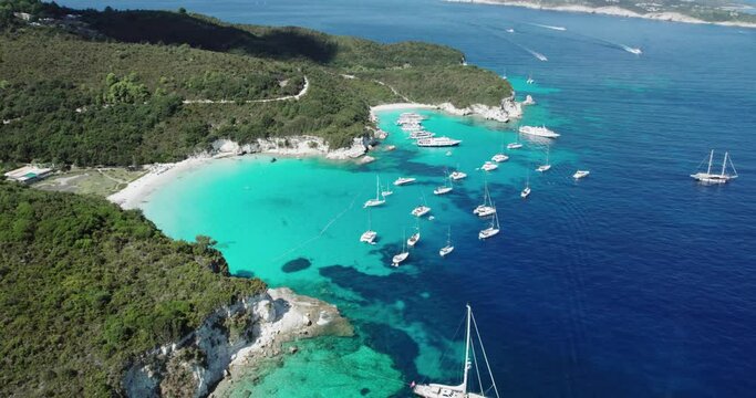 Aerial view of yacht boats achored at most beautiful beaches of Greece - Vrika in Antipaxos. Ionian islands