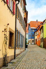 Colourful street of Rothenburg ob der Tauber, the Franconia region of Bavaria, Germany. Medieval old town. The most romantic town in Germany.