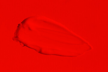 Beautiful texture of a rich, bright red color. Scarlet color. Texture of lipstick, eyeshadow, paint, liquid red. smear, smudge, matte.
