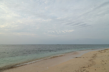 Lombok and Gili Air islands, overcast, cloudy day, sky and sea. Sunset, sand beach.