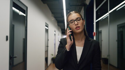 Financial assistant talking phone with annoyed client. Office manager make call