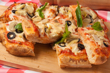 italian vegetarian pizza with zucchini mushrooms olives and cheese