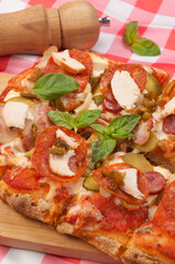 italian pizza with pepperoni, bacon, chicken and mushrooms