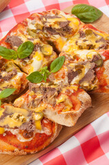 pizza with beef gherkins and jalapeno, mozzarella cheese and cheddar sauce
