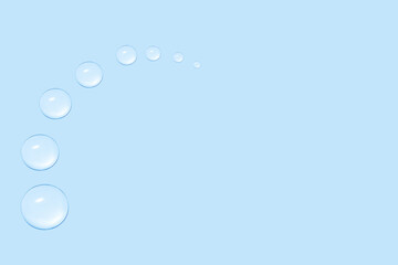Drops of transparent gel or water in the shape of a semi-circle, with decreasing size. On a blue background.