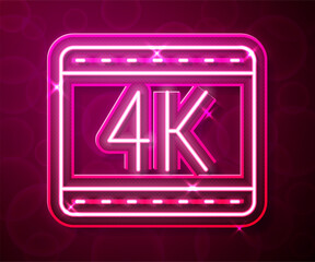 Glowing neon line 4k movie, tape, frame icon isolated on red background. Vector