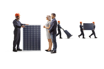 Factory worker with a solar panel talking to customers