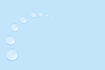 Drops of transparent gel or water in the shape of a semi-circle, with decreasing size. On a blue...