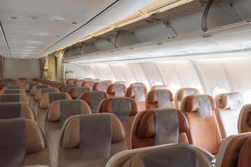 Fototapeta premium Commercial aircraft passenger seat and aisle cabin