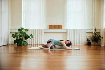 Woman practicing restorative yoga