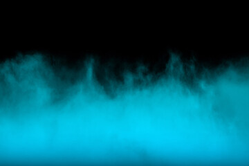 Abstract blue smoke moves on black background. Swirling smoke.