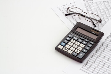 Office table with financial accounting and business planning with calculator