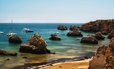 Scenic View Of Atlantic Ocean Shore In Portugal With Boats