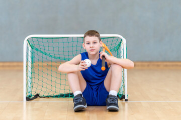 iFloorball child boy player with stick and ball. Horizontal sport theme poster, greeting cards,...