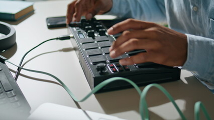 Man hands using console keyboard closeup. Unknown dj pushing buttons mixing song - obrazy, fototapety, plakaty