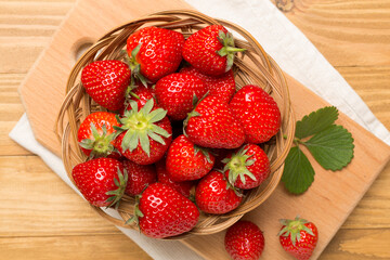 Strawberries on wooden background, top view