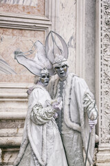 Gorgeous couple in masks during the Carnival of Venice