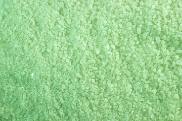 Small green crystals as background. Texture of red crystals