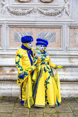 Fototapeta na wymiar Gorgeous couple in masks during the Carnival of Venice
