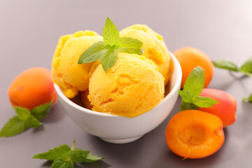 apricot ice cream scoop in bowl- summer refreshing