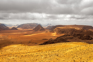 Top view of a canyon meandering through high sandstone mountains in the desert, Jordan