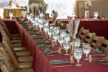 Elegant long table set up for an outdoor wedding reception