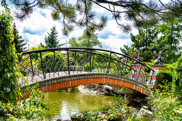 Beautifully standing old wooden bridge over river in colored background close up