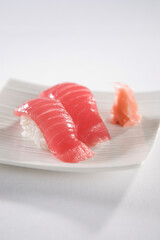 Sushi served on white plates