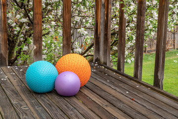 heavy slam balls filled with sand on a backyard deck, exercise and functional fitness concept