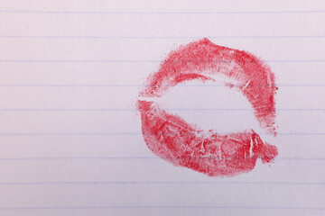 kiss print with red lipstick on white sheet. copy space for text
