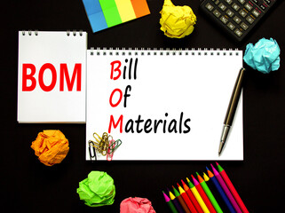 BOM bill of materials symbol. Concept words BOM bill of materials on beautiful white note. Beautiful black table black background. Calculator. Business and BOM bill of materials concept. Copy space.