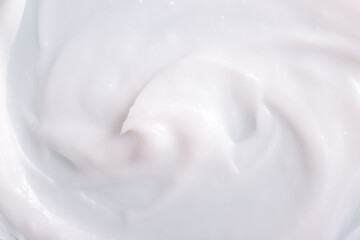 Fototapeta na wymiar Skin cream texture. Background with smeared white cream. Moisturizing lotion for face and body.