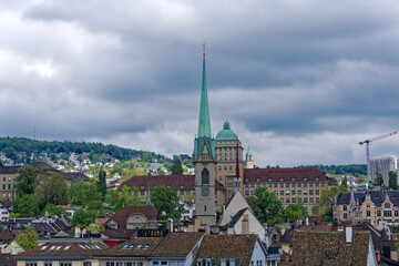 Fototapeta premium Scenic view of the medieval old town of City of Zürich with Preachers Church and University on a cloudy spring afternoon. Photo taken May 13th, 2023, Zurich, Switzerland.