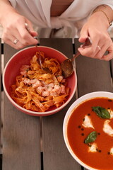 Table of italian meals on plates Pizza, pasta, ravioli, carpaccio, mushroom risotto, caprese salad and tomato bruschetta on rustic wooden background. Top view. Flat lay