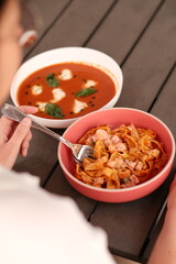 Table of italian meals on plates Pizza, pasta, ravioli, carpaccio, mushroom risotto, caprese salad and tomato bruschetta on rustic wooden background. Top view. Flat lay