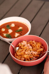 Table of italian meals on plates Pizza, pasta, ravioli, carpaccio, mushroom risotto, caprese salad and tomato bruschetta on rustic wooden background. Top view. Flat lay