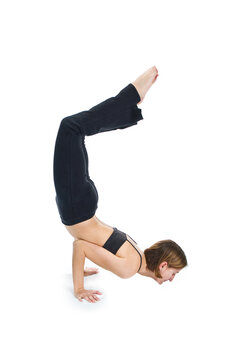 Young female gymnast practicing yoga.